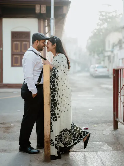 A different angle of their playful interaction. The focus on their happy expressions makes this a heartwarming shot.