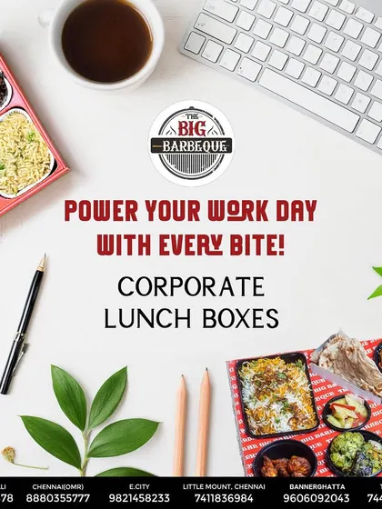 Power your team's workday with our corporate lunch boxes. This top-down view shows a complete, well-balanced meal with starters, main course, bread, and dessert, neatly packed and ready for office delivery.