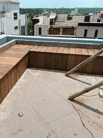 A work-in-progress shot of a custom L-shaped bench being built on a terrace. We use Ipe, one of the hardest woods in the world, to ensure maximum durability.