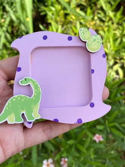 Another adorable dinosaur photo magnet, this one featuring a long-necked dino and its eggs.
