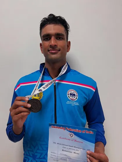 Siva Sridhar with his bronze medal from the 200m IM.