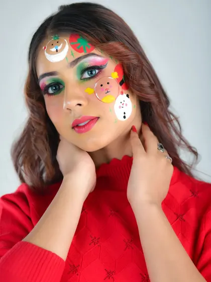 This angle shows the placement of the cute Christmas characters on the forehead and cheek. The look is playful yet polished, perfect for a holiday party or themed content.