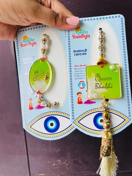 A matching bhaiya-bhabhi rakhi set with an evil eye theme to ward off bad vibes.