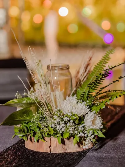A table centerpiece being set up by our decor team for a jungle-themed cocktail party.