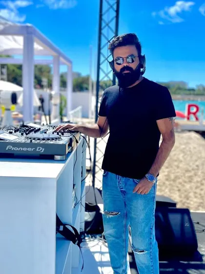 A sundowner set in Cannes, France. My work takes me global, and I'm an expert at crafting the perfect daytime beach party vibe, blending international hits with a relaxed, sophisticated feel for your corporate retreat or destination event.
