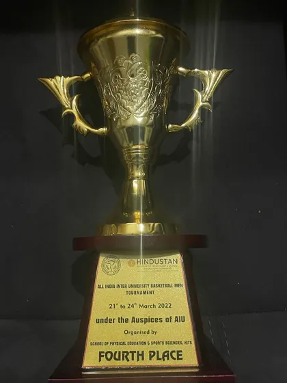 The fourth-place trophy from the All India Inter-University tournament. A strong finish on a national stage.