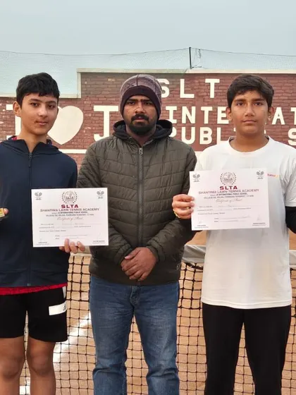 Anay Pandey stands with his coach and doubles partner after a triple-win performance at the CS7 Tournament in Sonipat. He secured titles in U-14 Singles, U-16 Singles, and U-16 Doubles, showing incredible versatility.