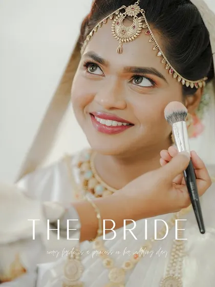A duplicate of a close-up shot of the bride getting her makeup done, a moment of calm and preparation before the big event.