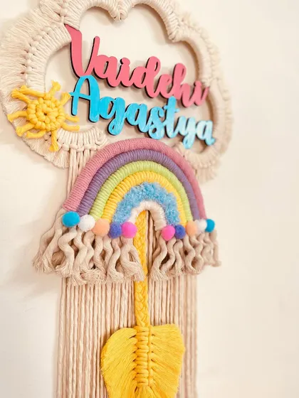 A beautiful pastel rainbow dreamcatcher for 'Vaidehi' and 'Agastya'. This piece is perfect for siblings and adds a soft, dreamy touch to their room.