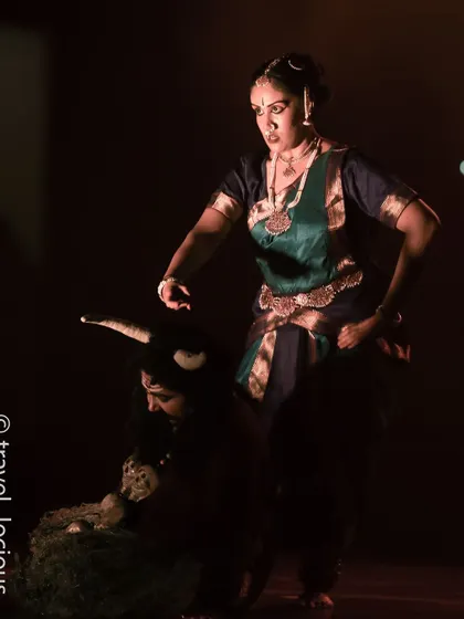Another angle of the dramatic scene, highlighting the expressive body language of the performers.