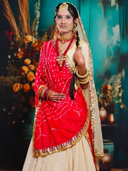 This image shows the full outfit and styling for a traditional bride. Our students learn not just makeup and hair, but also how to drape sarees and dupattas for a complete and polished look.