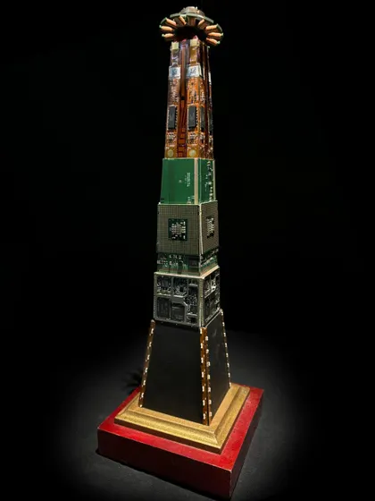 This custom award is designed to look like a skyscraper, built from stacked circuit boards and processors on a red wooden base. It's an elegant eco-design that makes a statement about innovation and sustainability.