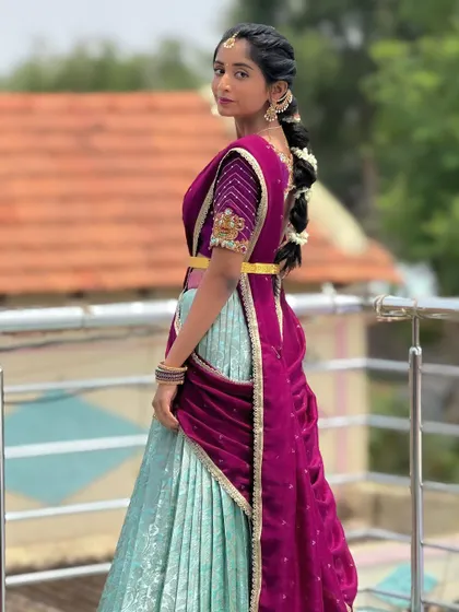 Client Hema looking lovely in her custom-designed half saree.