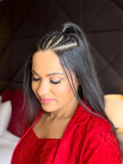 This angle shows the detail of the braids and the small ponytail that holds the style together. It's a fun and youthful look that works for many different occasions.