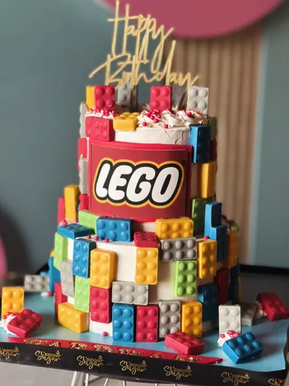 Piece by piece, this cake was built for fun. Our bright and bold LEGO-themed cake is perfect for a little builder's big day, with edible bricks and the classic LEGO logo.