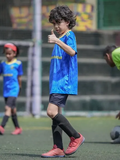Ready to own the week, one kick at a time. A player gives a thumbs-up during training.