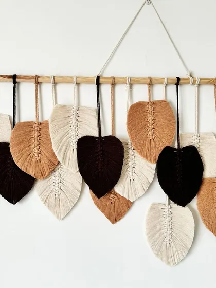 A detailed look at the rich colors and textures of the macrame feathers.