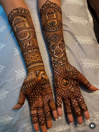 A rich and detailed design telling a story through symbols. It includes a doli, kalash, lotus, and elephants, perfect for a traditional bride.