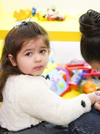 A close-up of a child getting her nails painted, a key part of our popular spa party package.