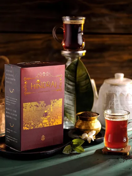 A moody and atmospheric shot of Hindraj black tea, focusing on the rich color of the brew. The dark, rustic styling evokes a sense of tradition and timeless quality.
