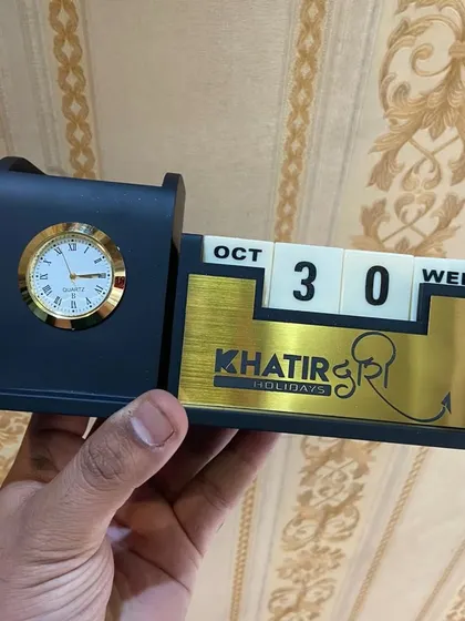 This desk calendar was customized for a travel company, 'Khatir Holidays', with their logo printed on the front. It's a great example of a branded corporate gift.
