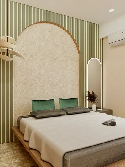 A tranquil bedroom retreat designed with a harmonious blend of earthy textures and soft green accents. The statement arched headboard, set against a striped wallpaper, creates a refined focal point. Natural wood details on the bed frame and wardrobe bring warmth and a sense of calm to the space.