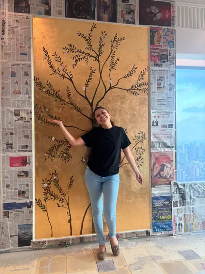 That feeling of completing a massive gold leaf mural. The view of the city from this high-rise apartment was a bonus. We'll talk about working in different environments, from corporate offices to luxury residences.