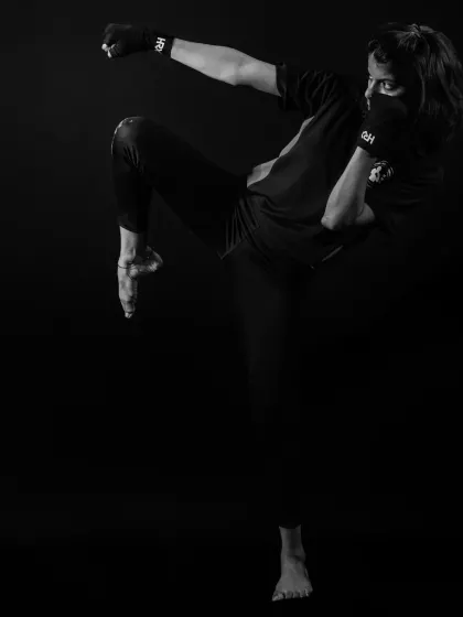 A demonstration of a powerful high kick, showcasing the flexibility and technique we develop in our kickboxing program.
