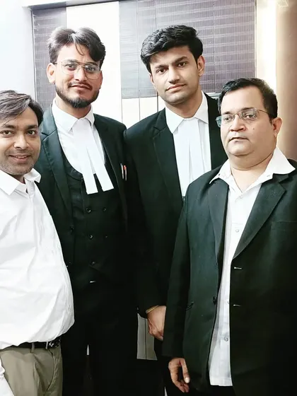 Posing with senior members and colleagues at the law office.