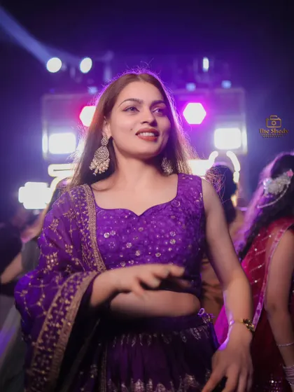A guest enjoying the music and dancing at the Sangeet. We capture the energy on the dance floor, preserving the fun memories of the night.