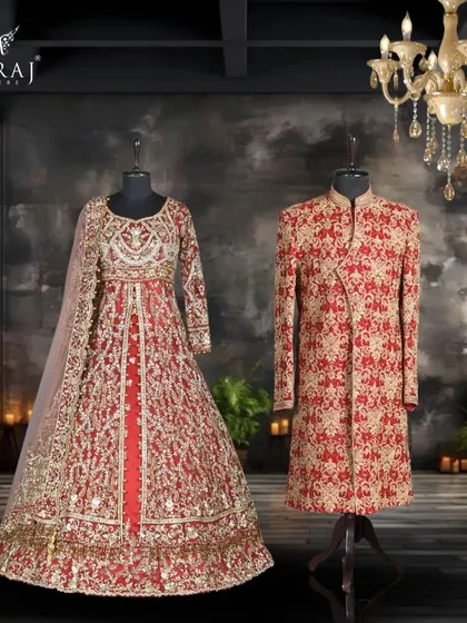 A powerful statement in red. The groom's velvet sherwani features traditional Persian motifs, creating a look of pure opulence that perfectly matches the bride's intricately embellished double tail Indowestern gown.