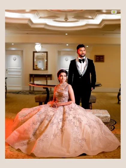 A posed portrait of the couple, with Aishwarya looking like modern royalty in her magnificent gown. Her makeup is polished and refined, designed for a grand and luxurious wedding.