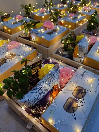 A close-up of our planter-themed Diwali hamper, lit up to create a festive glow.