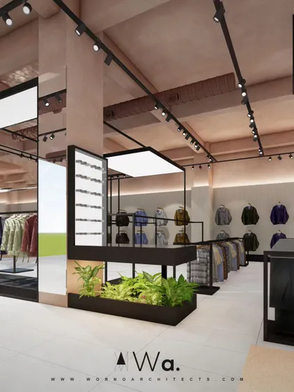 This view highlights the use of mirrors and integrated planters within the display fixtures. These elements help to make the space feel larger and brighter while reinforcing the natural, modern aesthetic.