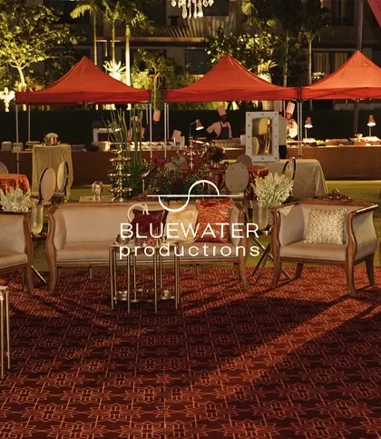 The lounge area is set against the backdrop of the food tents, showing the overall layout of the event.