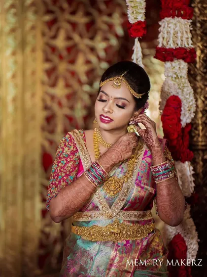 A beautiful portrait of the bride, ready for her ceremony. The classic bun and floral arrangement are key elements of a traditional bridal hairstyle.