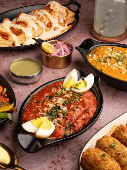 A full spread of North Indian delicacies we shot for a restaurant client. This top-down view captures the variety and richness of the dishes, from creamy curries to appetizers, perfect for a menu or promotional banner.