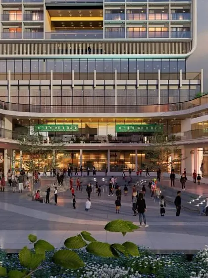 This render for a commercial space shows a vibrant central courtyard designed for peak activity. The open plaza is surrounded by retail and recreational areas, creating a dynamic public hub that encourages community engagement.