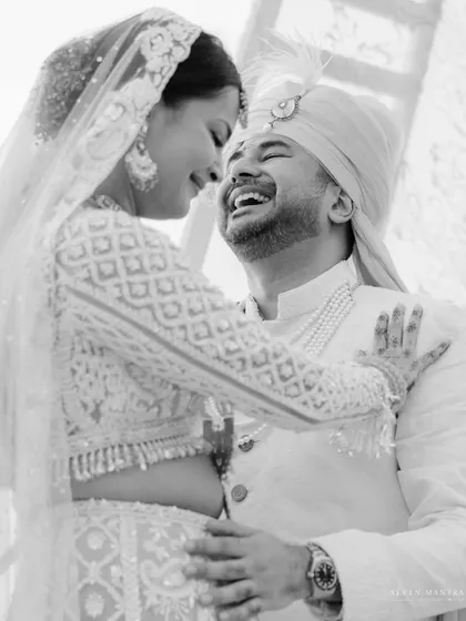 Pure joy captured in black and white. This candid embrace between Shreya and Dhruv is a testament to their happy and loving connection.
