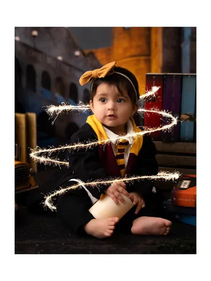 Adding a touch of magic with sparkler effects to this Harry Potter-themed baby shoot.