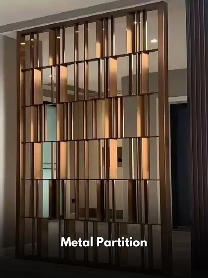 A metal partition can act as a sculptural element in a room. This design features a dynamic arrangement of reflective panels that play with light and create a sense of modern luxury.