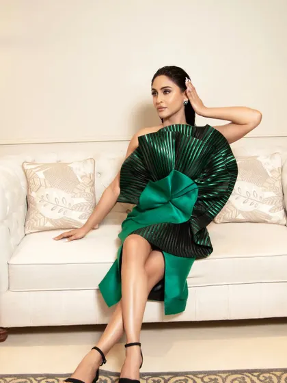 Here is the complete look for Krystle, where the makeup and slicked-back wet hairstyle come together to complement her bold, architectural green dress. This demonstrates how I style a cohesive, head-to-toe appearance for high-fashion events.