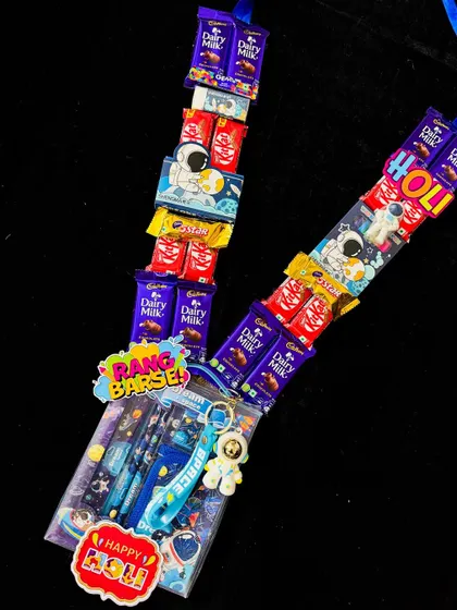 This space-themed chocolate garland is another fun option for kids this Holi. It features an assortment of chocolates and a space-themed stationery set, making it a gift that is both sweet and creative.