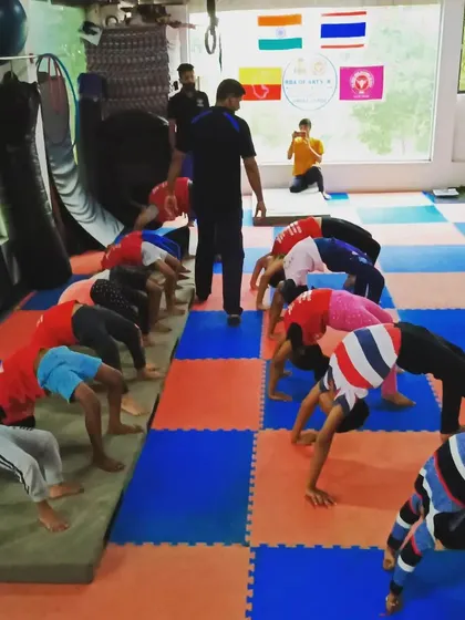 I am guiding a class through backbend drills. We focus on proper form to increase spinal flexibility safely and effectively.