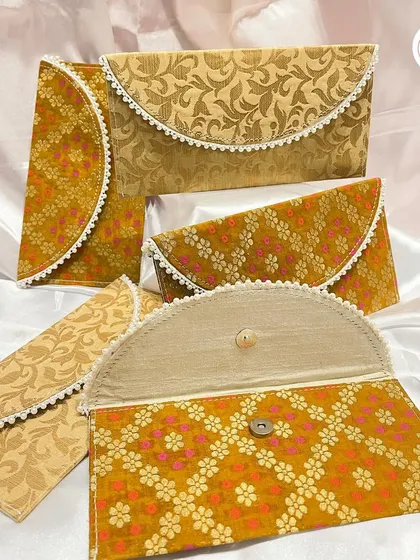 Custom fabric envelopes or clutches are a stylish and reusable wedding favor. I can create them in various brocade patterns and colors to match your wedding theme.