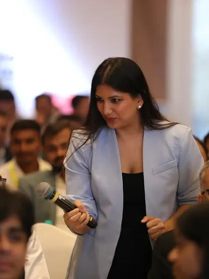 Moving through the audience during an interactive segment. This is a great way to make a large room feel intimate and encourage participation.