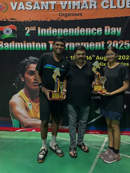 C Group Mixed Doubles winners and runners-up from the Independence Day tournament.