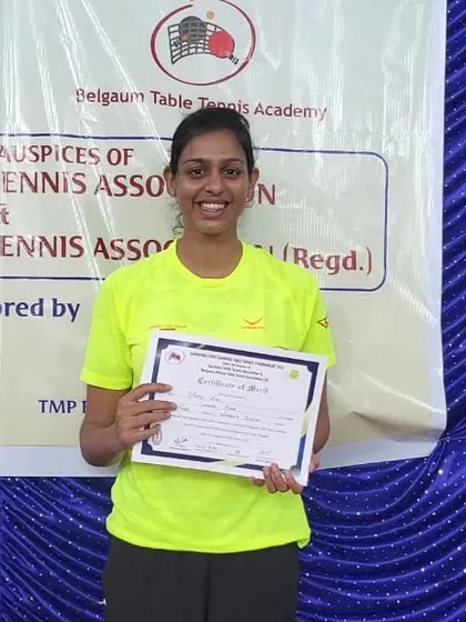 Maria Rony with her certificate after claiming the bronze medal in the women's singles event in Belgaum.