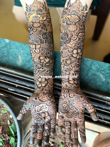 The combination of delicate vines and bold floral work gives this design a unique and captivating look.