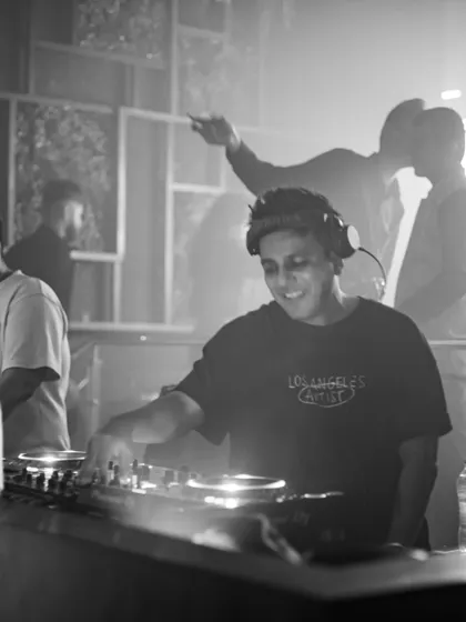 Another black and white portrait, capturing a moment of intense focus during my set.